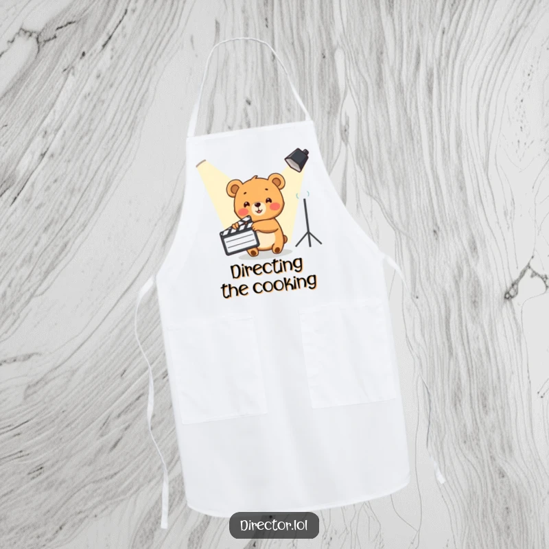 Funny Bear Cub Apron: Cute bear cub points a clapboard at a spotlight, perfect for a movie-themed kitchen.