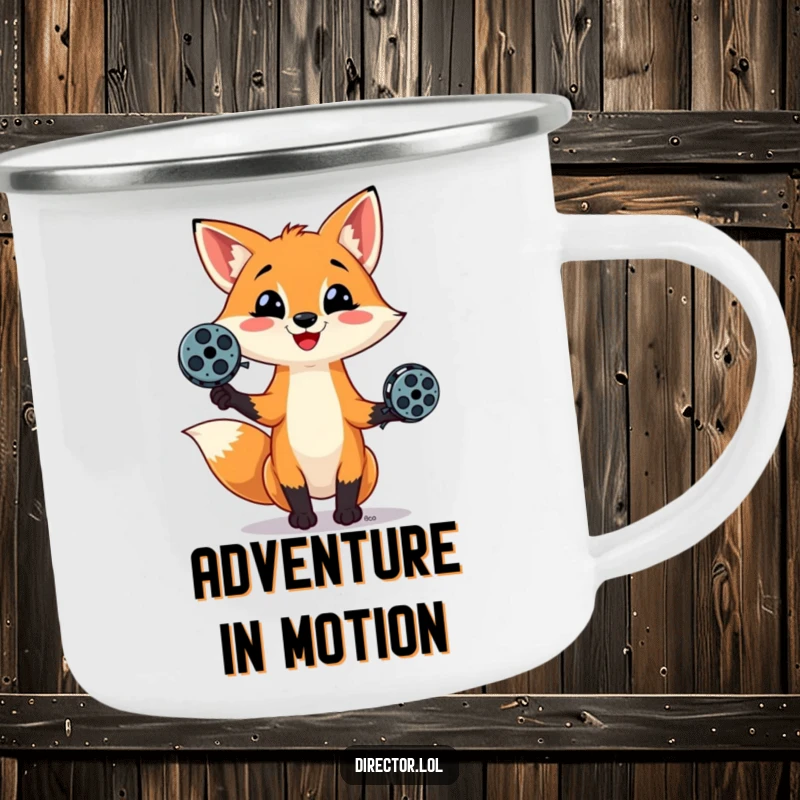 Funny camping mug showing a mischievous fox juggling film reels, ready for outdoor adventures and cinematic storytelling around the fire.