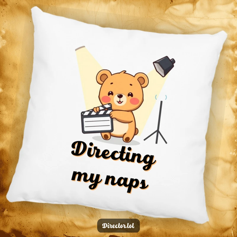 Funny Bear Cub Pillow: Cute bear cub enthusiastically points a clapboard towards a spotlight, a cozy movie accent.