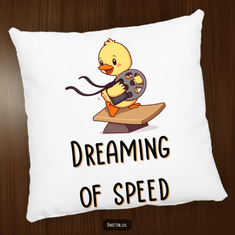 Funny determined duckling sliding down a ramp with a film reel, a comfortable and humorous decorative pillow for movie buffs.