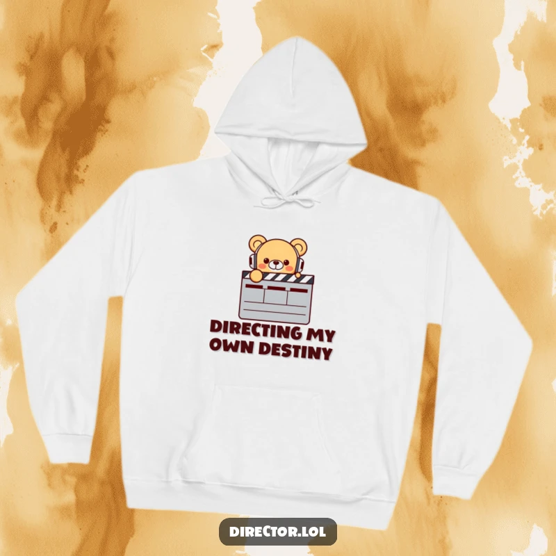 Funny Bear Director Hoodie: Cozy smiling bear with headphones points at a clapperboard, radiating enthusiasm for filmmaking, a warm funny gift.