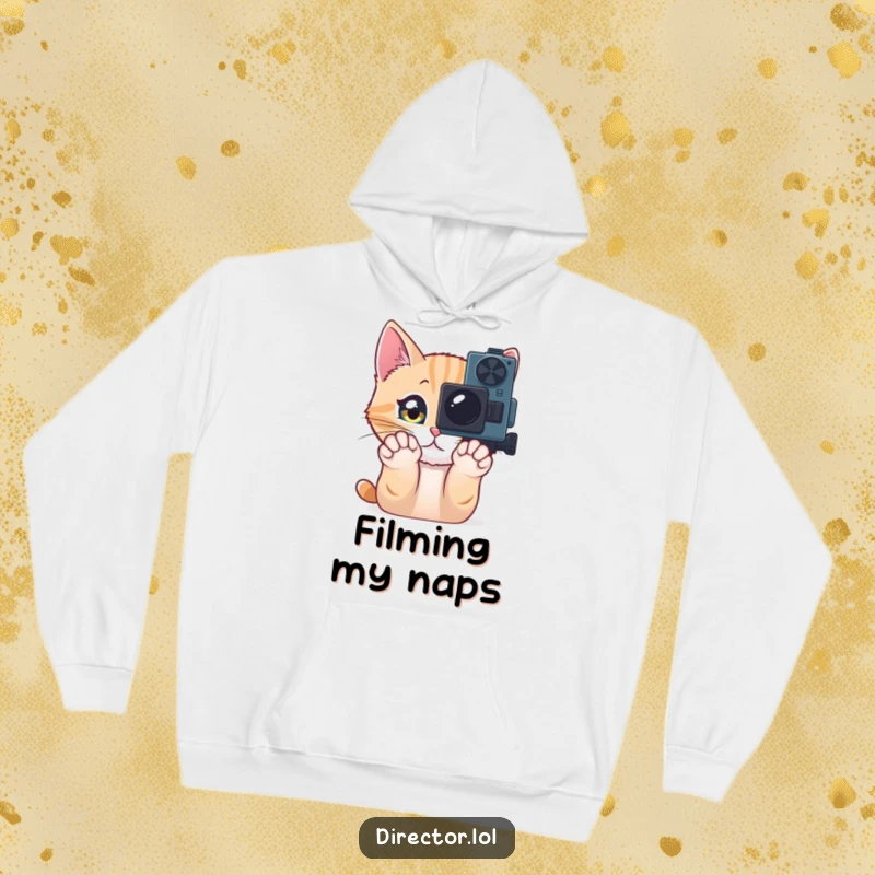 Funny Hoodie featuring a curious cat pawing at a movie camera, offering comfort and a humorous touch for film lovers and their furry friends.