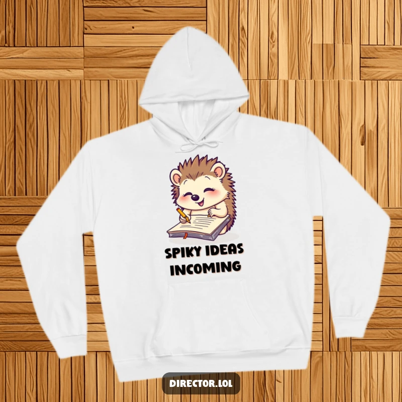 Funny giggling hedgehog scribbling notes on a giant yellow notepad, a cozy and humorous hoodie for creative thinkers.
