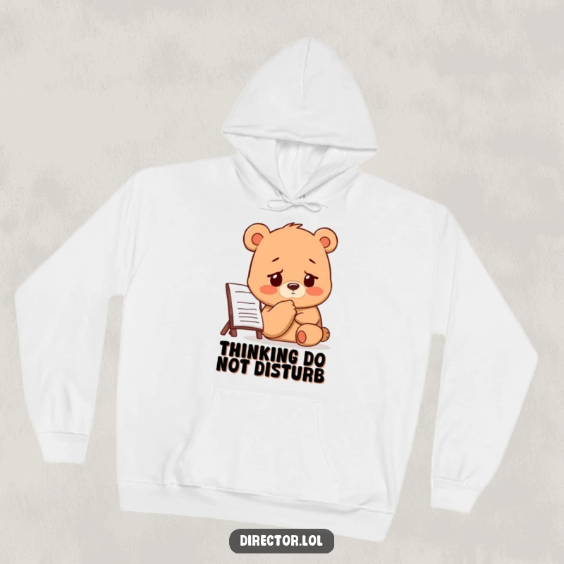 Funny Bear Director Hoodie: A bear thoughtfully taps its chin while gazing at a storyboard with a concentrated, furrowed brow.