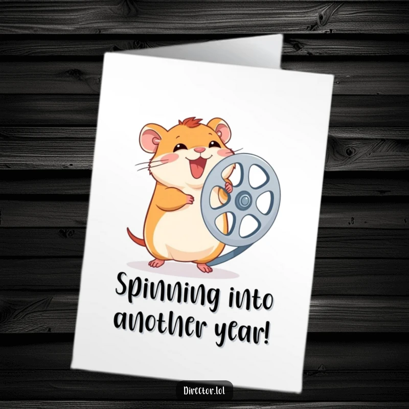 Funny Free Printable Birthday Card: Giggling hamster excitedly spins a large film reel, ready for a cinematic celebration.