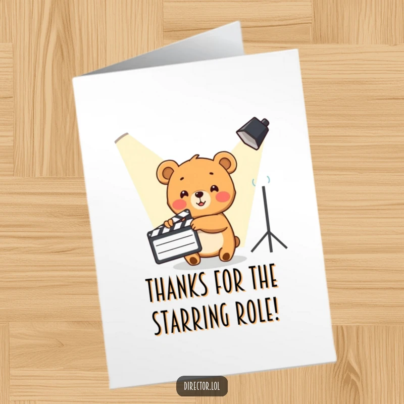 Funny Free Printable Thank You Card: Cute bear cub enthusiastically points with a clapboard towards a spotlight, showing thanks.