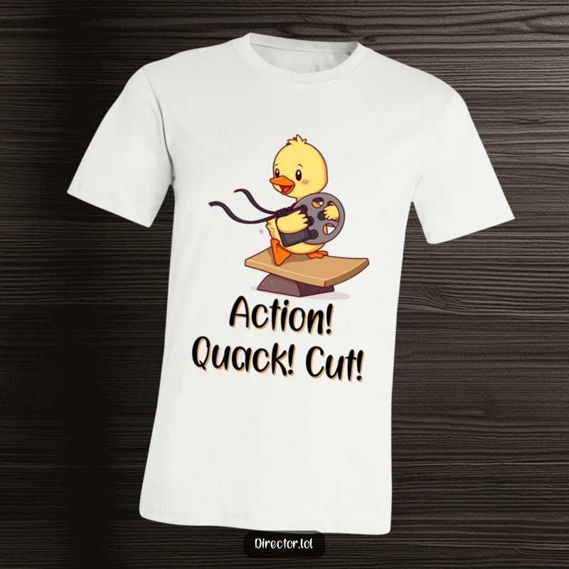 Funny determined duckling sliding down a ramp with a film reel, a humorous graphic t-shirt celebrating cinema and cuteness.