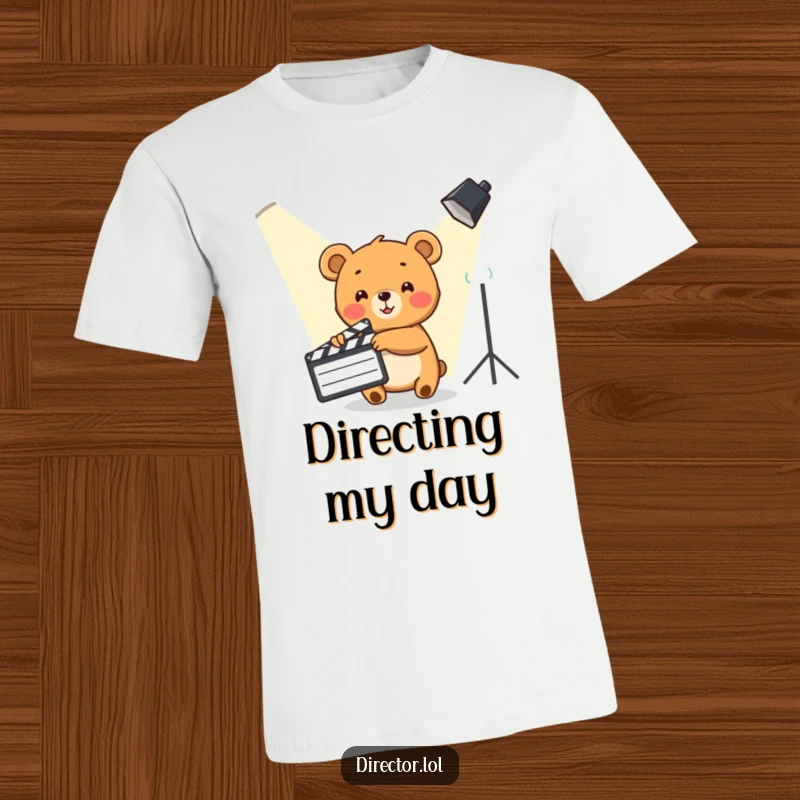 Funny Bear Cub T-Shirt: A cute bear cub enthusiastically points a clapboard towards a spotlight, ready for action.