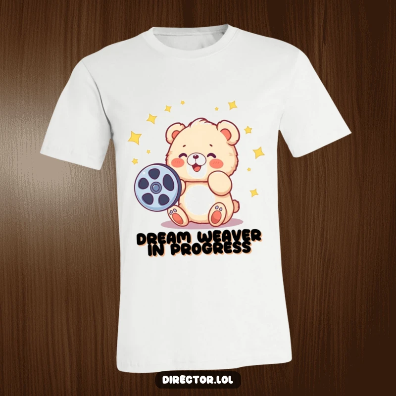 Funny t-shirt with a fluffy cartoon bear cub gleefully spinning a film reel, stars around its head, celebrating movie-making.