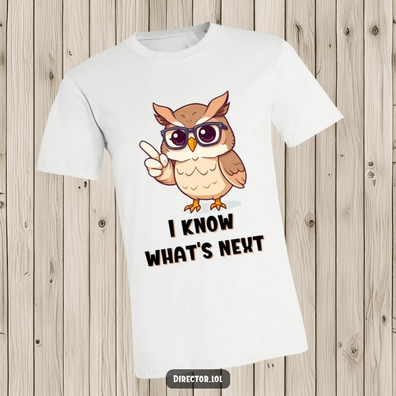 Funny T-Shirt: Proud owl with glasses pointing decisively at an unseen stage, representing theatrical direction.