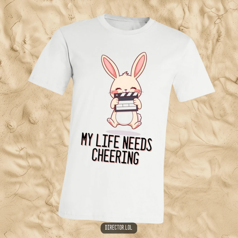 Funny t-shirt showing a giggling cartoon bunny holding a clapboard and jumping with pure delight.