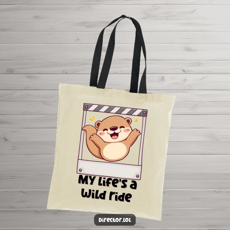 Funny Tote Bag: Adorable otter gleefully sliding down a storyboard frame, celebrating filmmaking with pure joy.